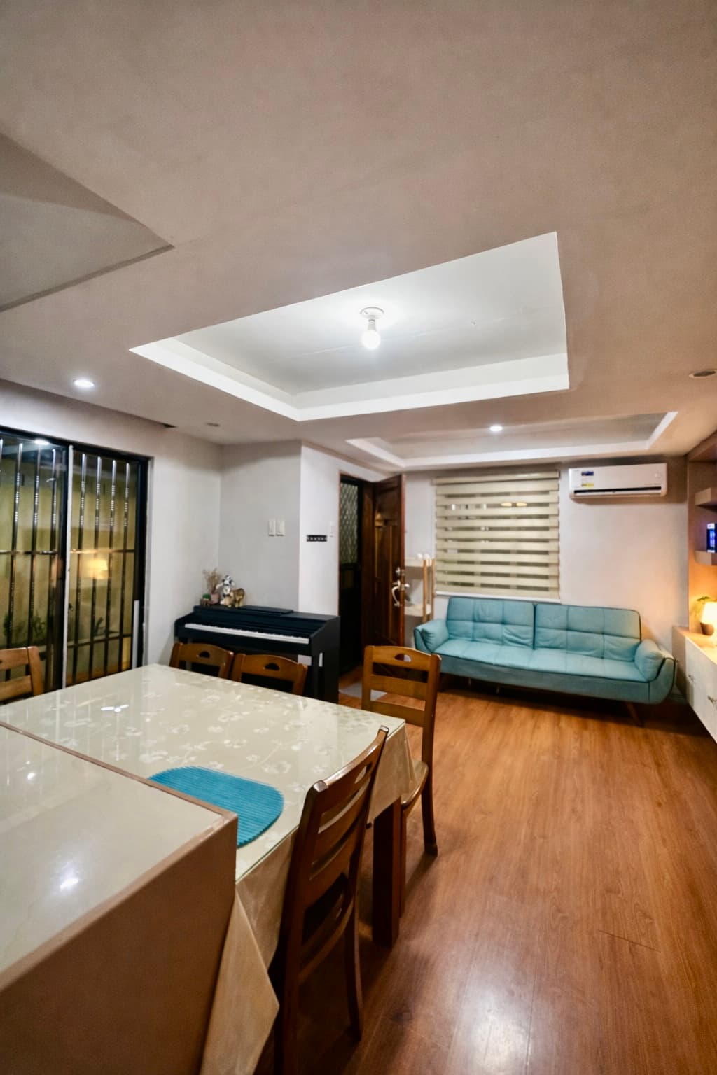 Dining area, living room, and piano